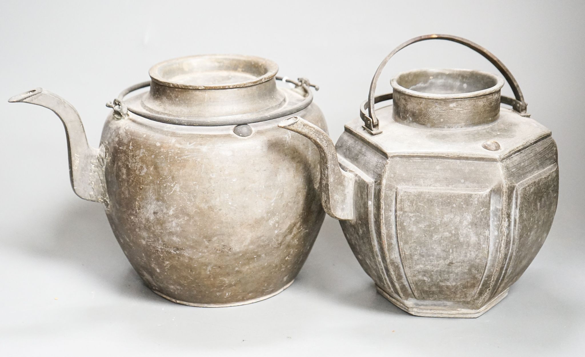 Two Chinese pewter teapots, late 19th/early 20th century, largest 23cm across